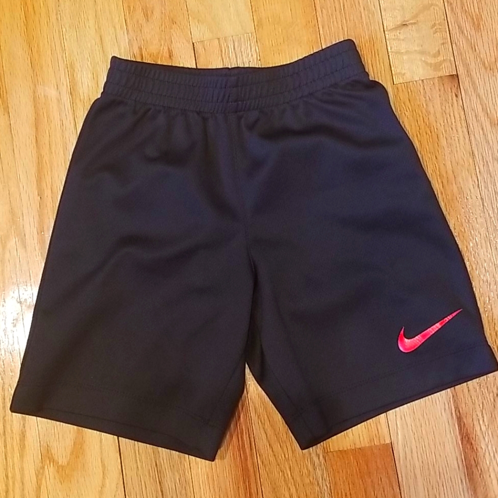 Nike boys black mesh shorts with red nike logo